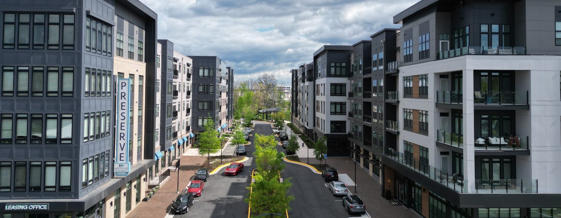 a street with cars and buildings on either side of it