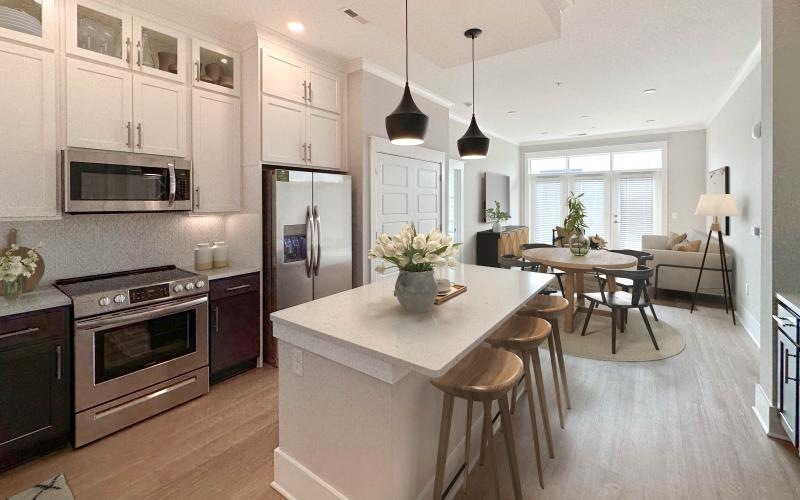 a kitchen with a dining table and a stove