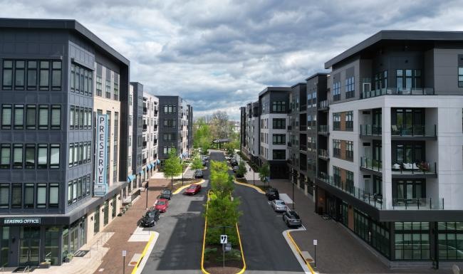a street with cars and buildings on either side of it