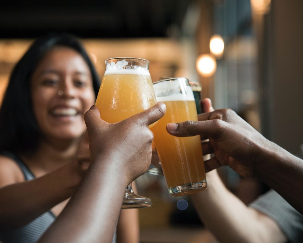 friends enjoying beer in resident clubroom